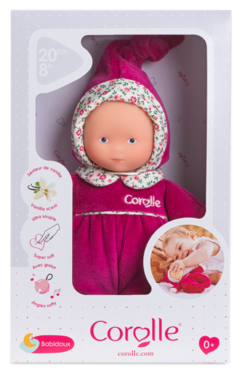 Babidoux Pink Grenadine soft toddler doll with vinyl face, floral hood, and cuddly pink outfit in packaging.