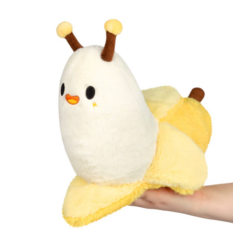 Banana Slug Mini plush toy held in hand, featuring a cute white and yellow slug design.