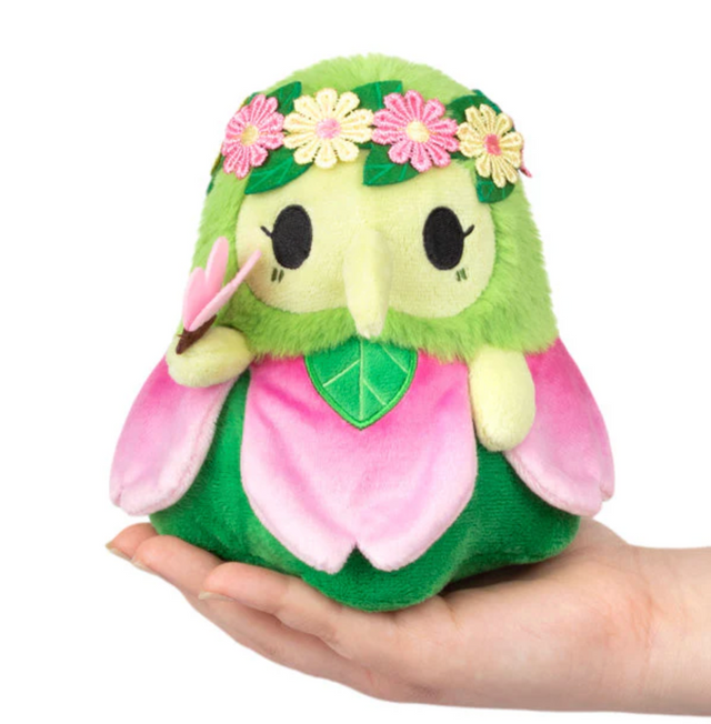 Alter Ego | Plague Doctor Nymph plush with green and pink petals and flower crown held in hand.