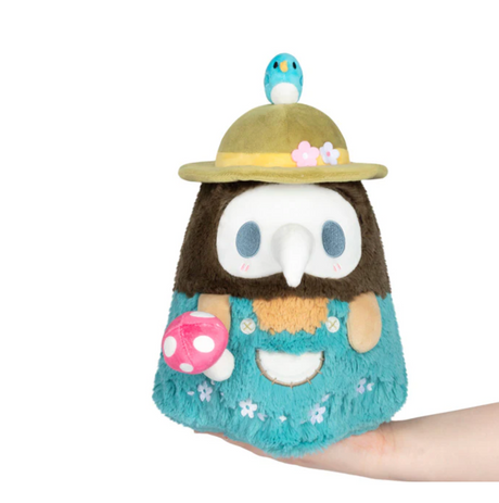 Spring Mushroom Plague Doctor plush with pastel colors, a blue bird, and a pink mushroom held in hand.