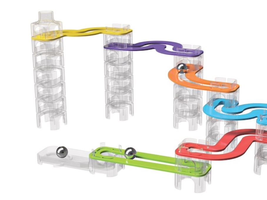 Trestle Tracks Builder Set with clear stacking cubes and colorful tracks guiding stainless steel marbles through twists and slopes.