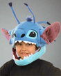 Child wearing the plush Disney Stitch Jawesome Hat with large ears, antennae, and inner size adjuster.