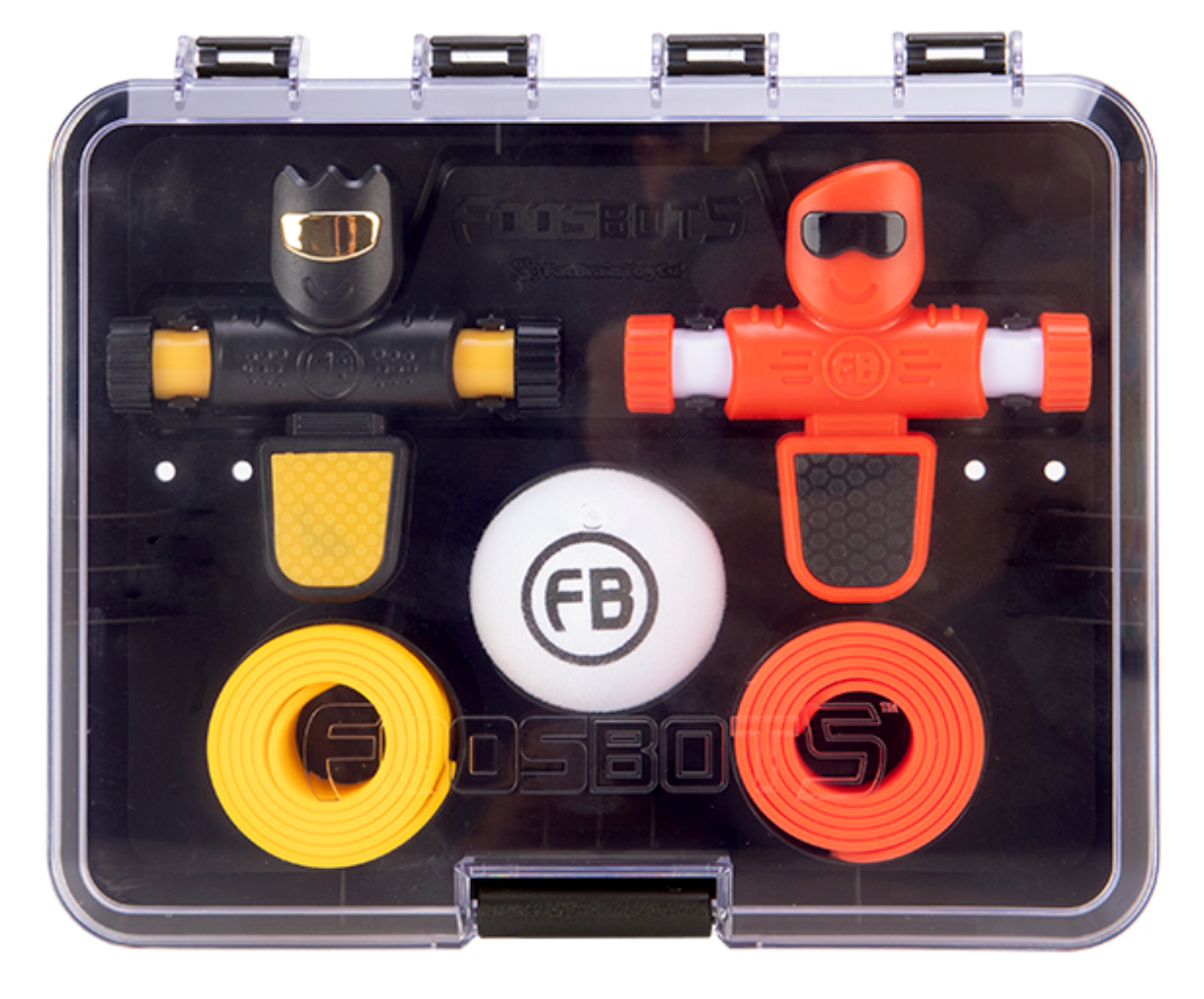Foosbots 2 Pack featuring two colorful spinner bots, silicone goal lines, and a ball in a compact storage case.