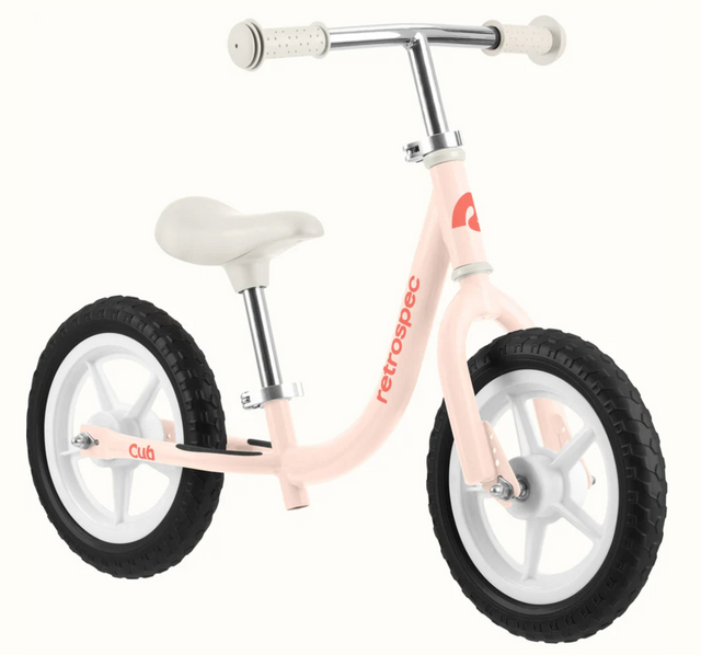 Cub Balance Bike | Blush with step-through frame, adjustable seat, and puncture-proof airless tires for ages 18 months to 4 years.