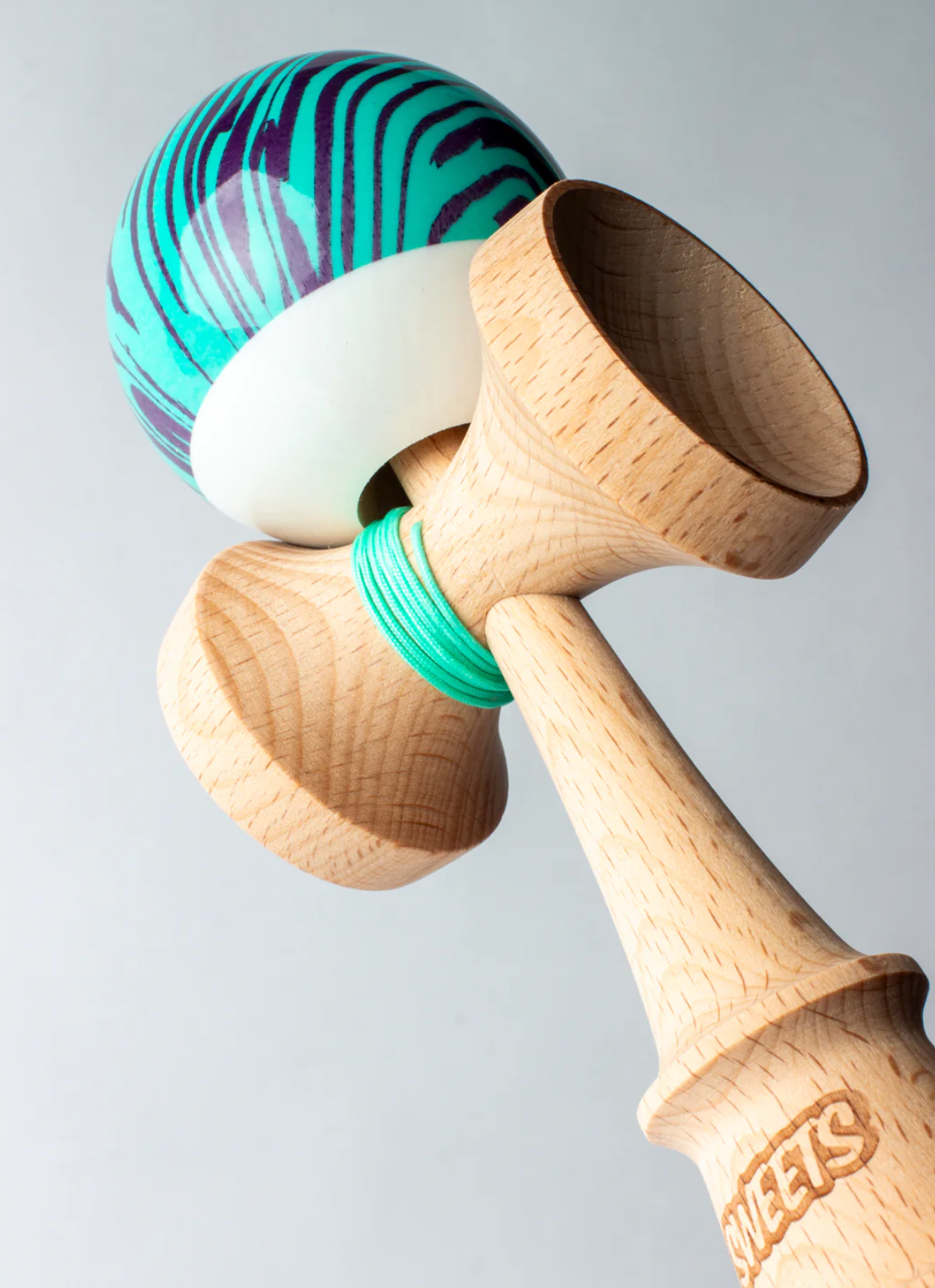 Kendama Prime Grain Split | Laser Tag with turquoise string, wood grain handle, and white tama bottom for easy tracking.