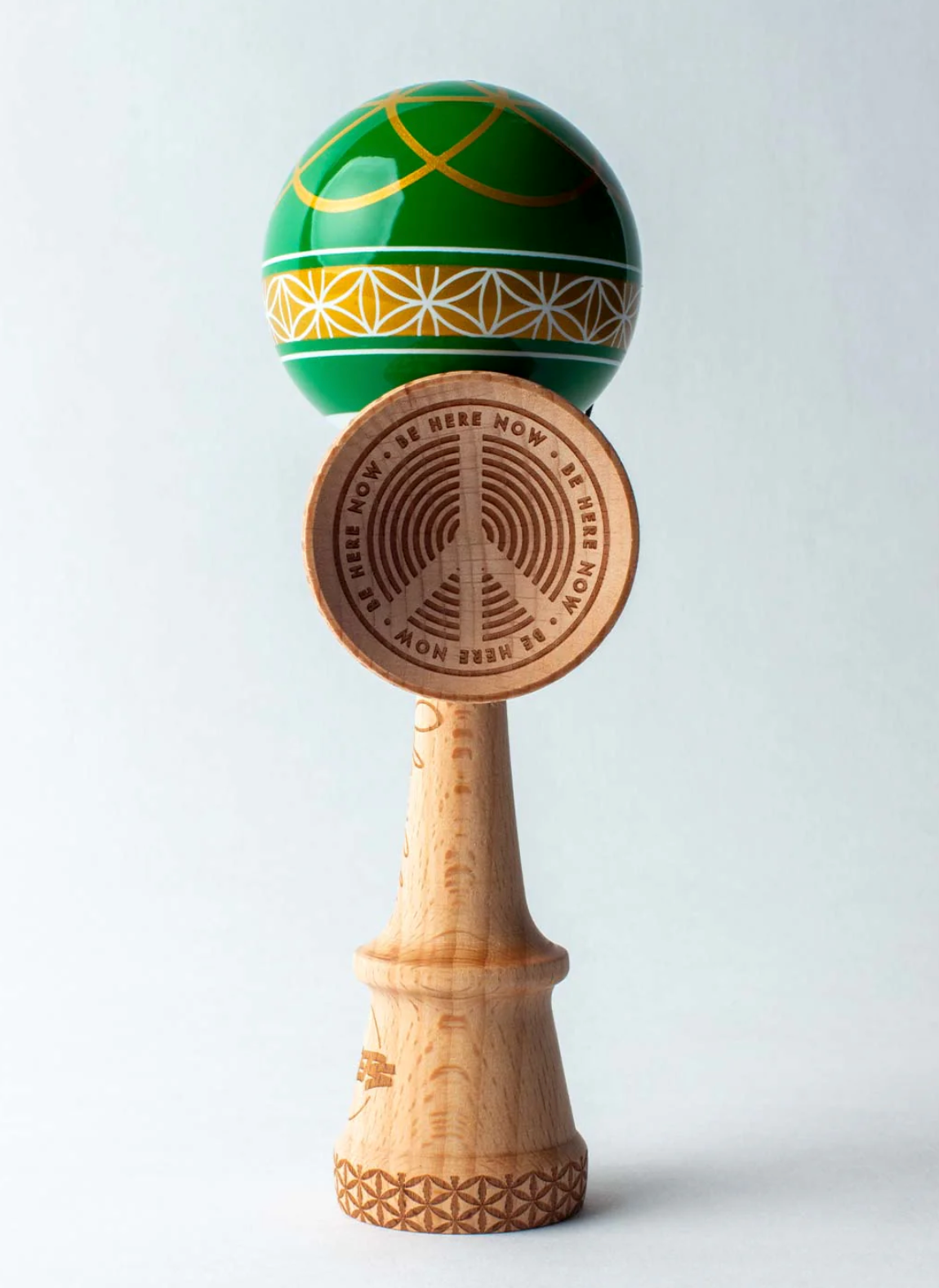 Kendama Johnny Raekes V2 BS Sticky with green tama and wooden base featuring Be Here Now design and intricate patterns.