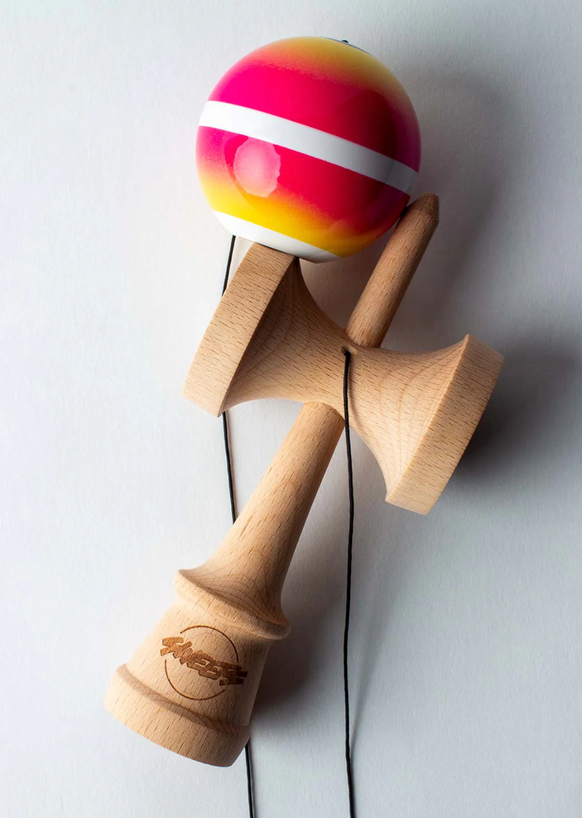 Kendama Horizon Fade | Pink/Yellow with natural wood ken and pink to yellow fade tama with white center stripe and black string.