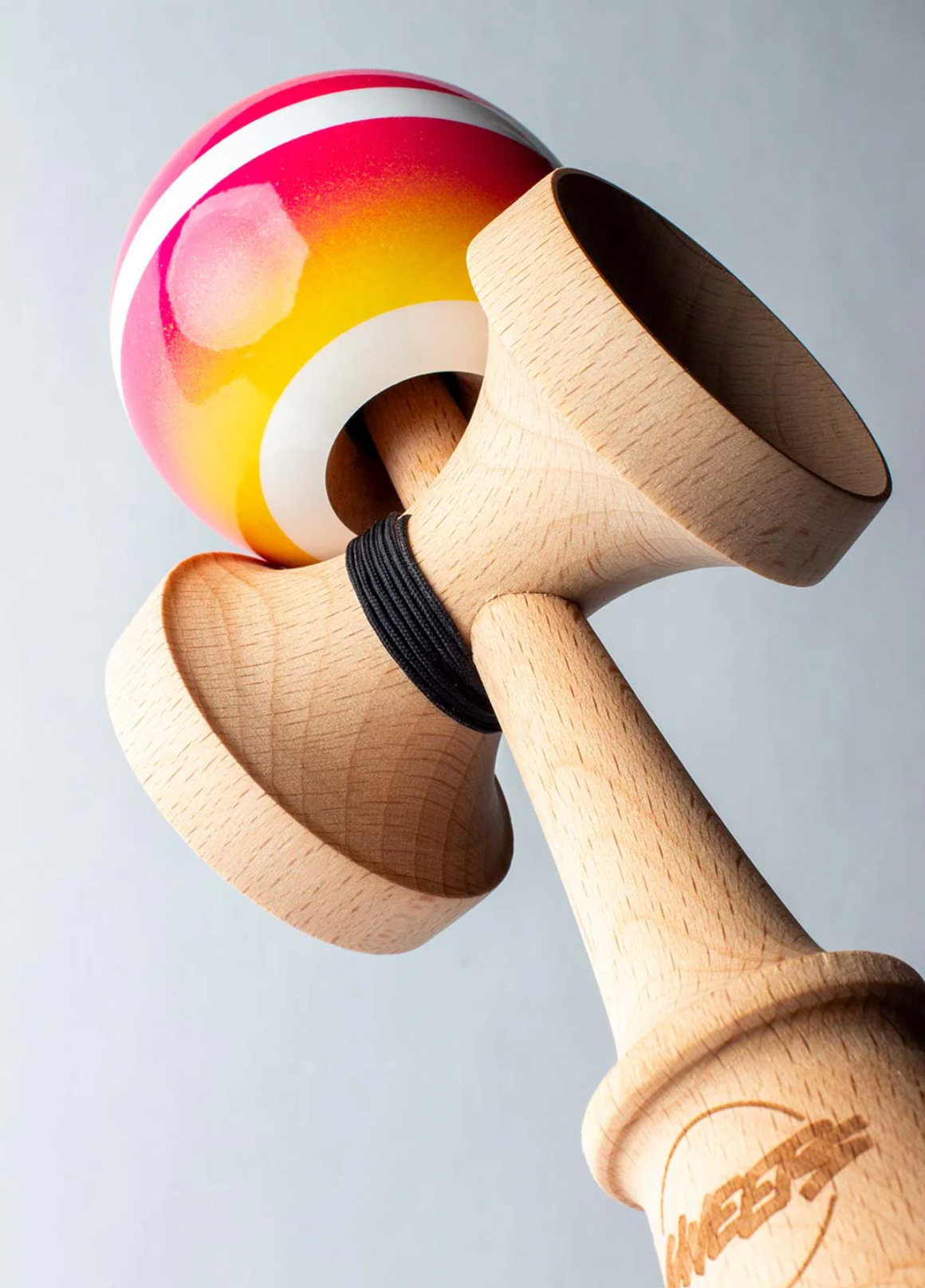 Kendama Horizon Fade | Pink/Yellow with a two-color fade tama, white stripe, and natural wood ken in Broken Shape design.