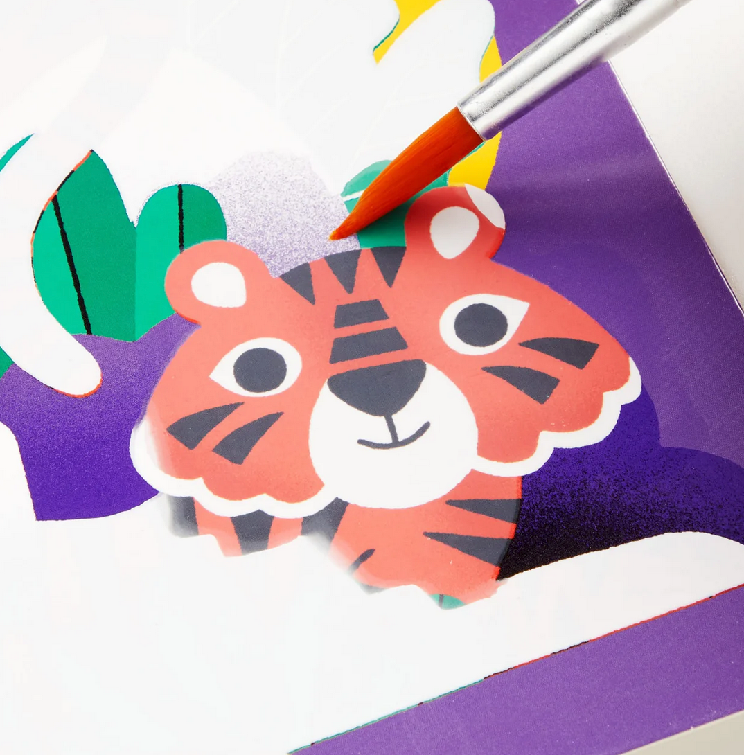 Color Magic Water Reveal | Rainforest Friends shows a brush uncovering a colorful tiger illustration on the water reveal sheet.