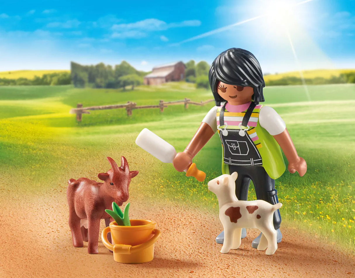 Special Plus | Woman with Goats figure bottle feeding two goats in a sunny farm setting with accessories.