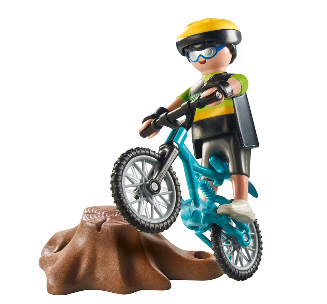 PLAYMOBIL Special Plus Mountain Biker figure riding blue bike over obstacle with helmet and goggles.