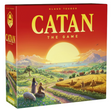Catan 6th Edition board game box featuring a vibrant sunrise over a lush, hexagonal landscape with settlers and sheep.