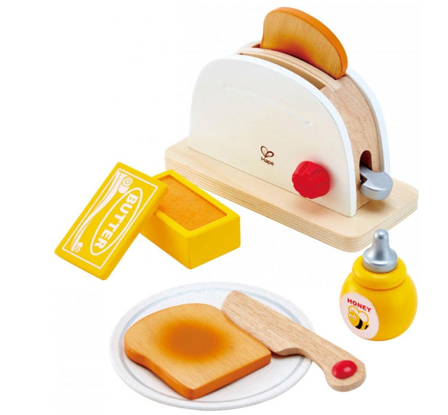 Pop-Up Toaster Set with wooden toaster, two toast slices, butter, honey bear, and a plate with a wooden knife for kids.
