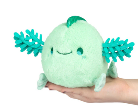 Mint Baby Axolotl Snackers plush in a soft mint color with smiling face and cute limb details, perfect for cuddling.