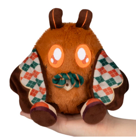 Alter Ego | Professor Baby Mothman plush with big eyes, patterned wings, and soft brown fur held in hand.