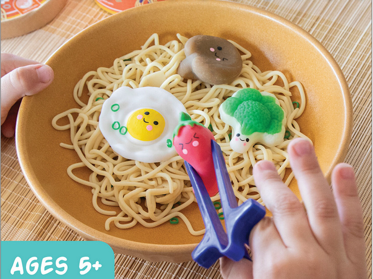 Foodie Fidgets Ramen Noodles squishy toys with stretchy noodles, broccoli, egg, mushroom, and chopsticks for tactile play.