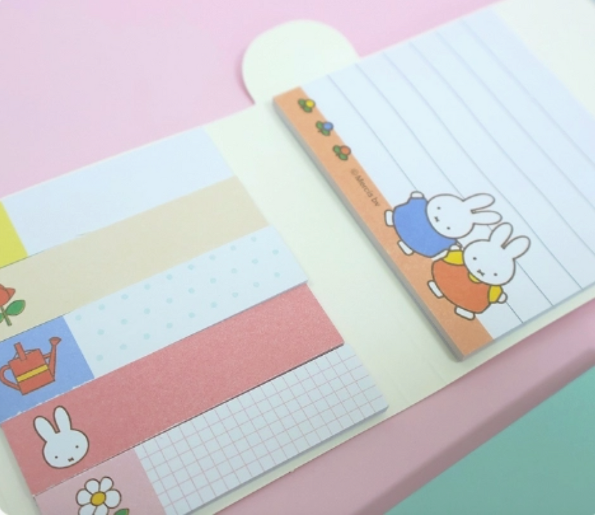 Folded Miffy sticky memo pad set showing pastel-colored note sections with cute rabbit illustrations and simple designs.