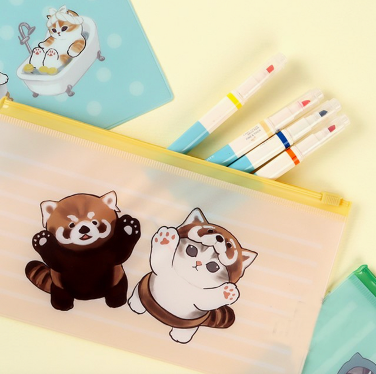 Soft translucent pencil pouch with cute MofuSand animal illustrations and a yellow zipper on a light background