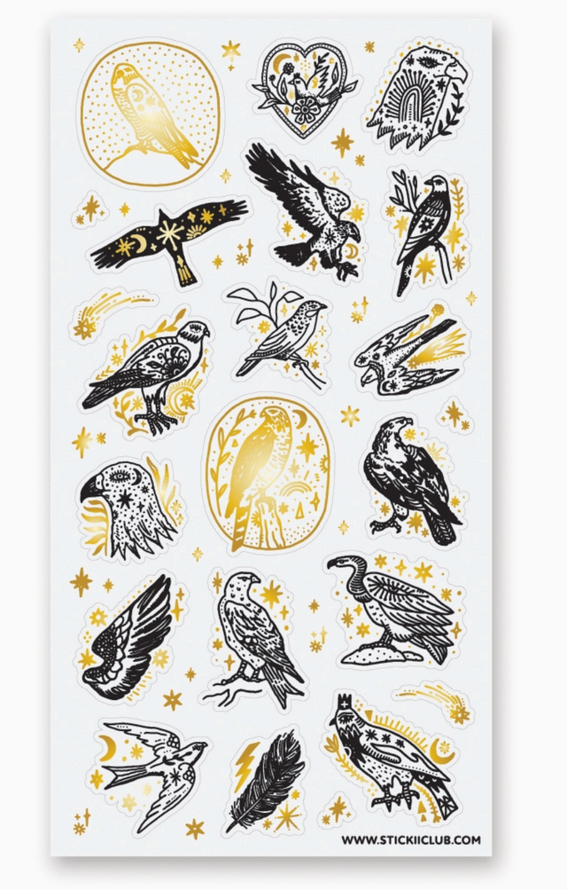 Set of black and gold foil birds of prey stickers surrounded by stars and celestial designs for nature lovers.
