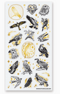 Set of black and gold foil birds of prey stickers surrounded by stars and celestial designs for nature lovers.