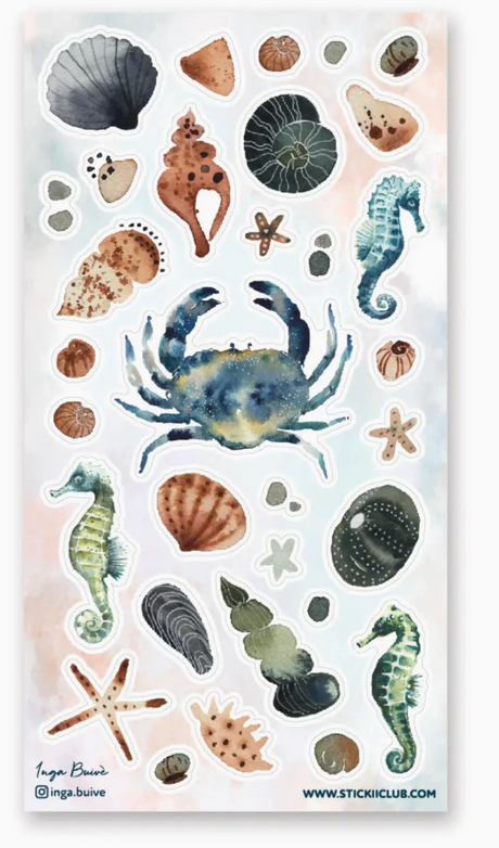 Watercolor stickers of marine life including crab, seahorses, seashells, starfish, and ocean treasures on a soft background.