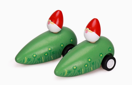 Two wooden pullback garden gnome toys with red hats and green floral bodies on wheels for kids.