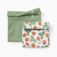 Two reusable snack pouches, one solid green and one with a strawberry pattern, both with snap closures.