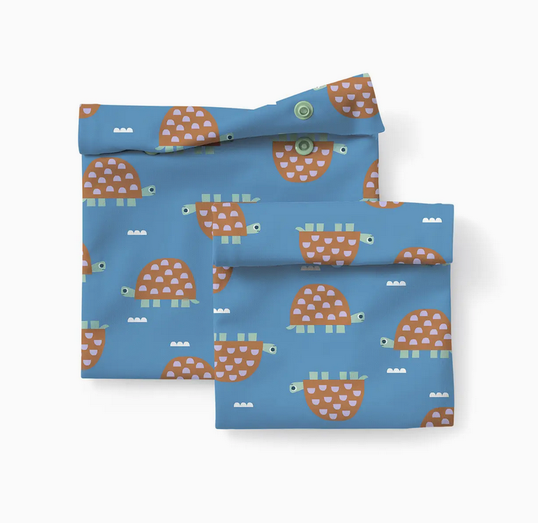 Reusable Snack and Sammy pouches in blue with playful turtle illustrations for eco-friendly lunch packing.