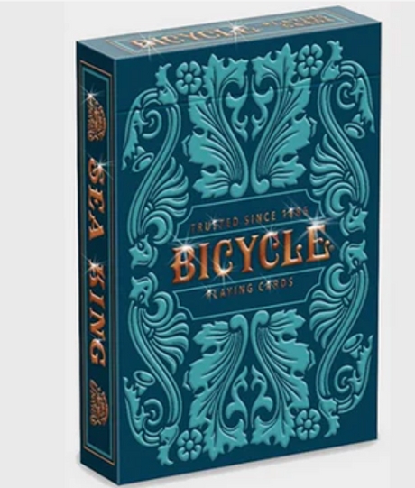Bicycle Sea King playing cards box with intricate sea-inspired teal and blue embossed design and gold lettering.