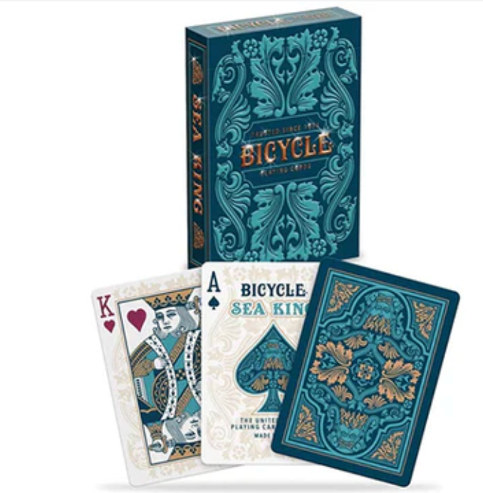 Bicycle Sea King playing cards with teal and gold sea-inspired design, embossed tuck, and intricate patterns on box and cards.