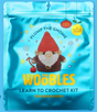 Flump the Gnome crochet kit packaging with a red hat gnome and holiday-themed design for beginners learning crochet.