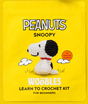 Yellow packaging featuring a crocheted Snoopy figure with black ears and red collar for beginner crochet kit.