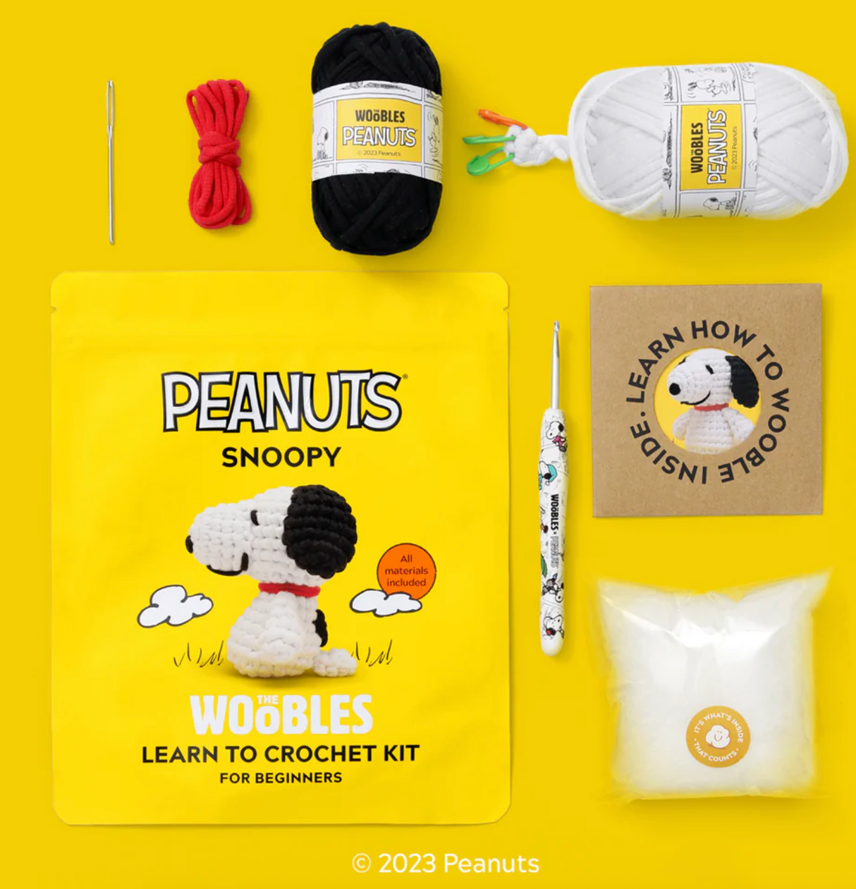 Beginner crochet kit featuring Snoopy materials, including yarn, hook, stuffing, needle, and easy instructions.