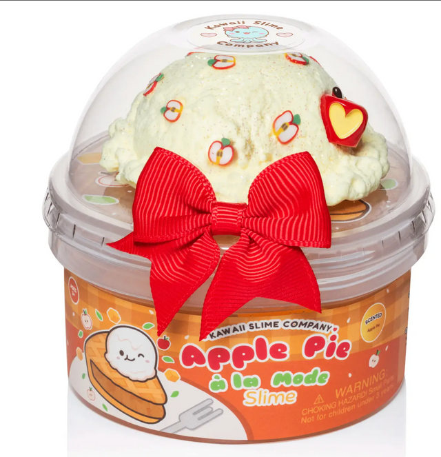 Slime container topped with apple-themed jelly cubes and a red bow, inspired by apple pie à la mode dessert.