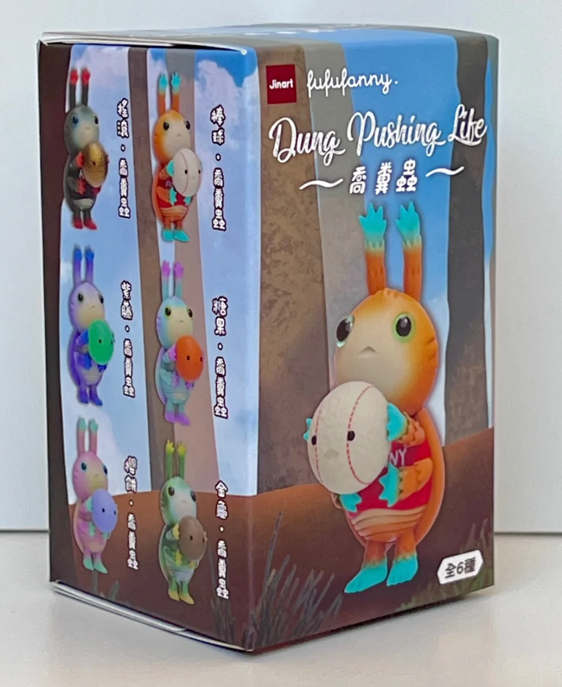 Colorful dung pusher beetle collectible figurine in a blind box with six possible designs shown on the packaging.