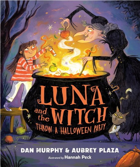 Young girl and witch brewing a magical potion in a cauldron for a Halloween party with a curious black cat nearby