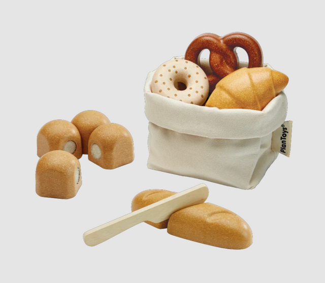 Wooden play bread set with bagel, rolls, pretzel, croissant, cuttable baguette, knife, and fabric storage bag