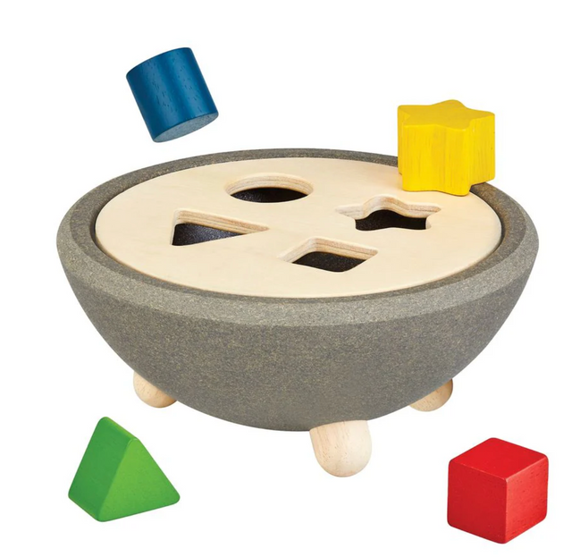 Wooden shape sorting bowl with colorful geometric puzzle pieces for preschool learning and coordination development