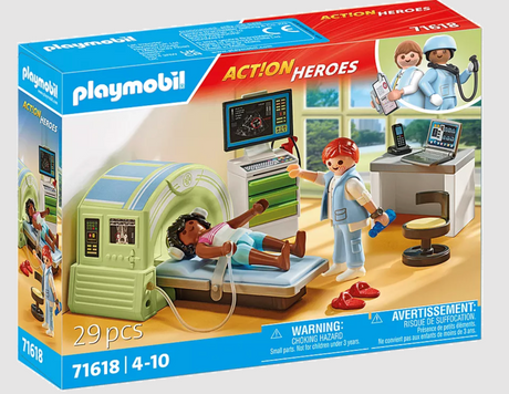 Playmobil set with doctor examining child inside MRI machine with computer and medical accessories on desk