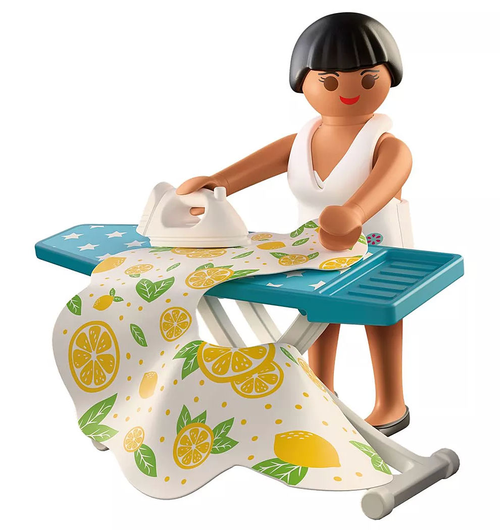 Figure using iron on a colorful lemon-patterned cloth on a blue ironing board with accessories