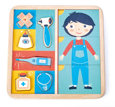 Wooden educational puzzle showing a child and common medical items to teach about the human body and health care.