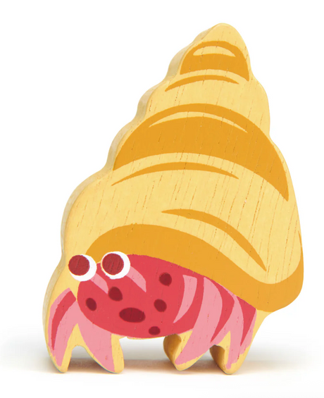 Small wooden hermit crab toy with painted shell and legs, designed for imaginative play and seaside adventures.