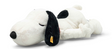 Large plush Snoopy lying on tummy with closed eyes and relaxed smile, ears softly hanging down.