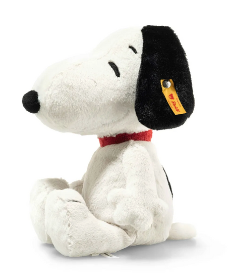 Soft plush Snoopy toy sitting with closed eyes and a red collar, perfect for play or display.