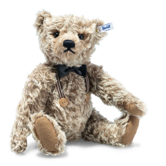 Handmade caramel mohair teddy bear wearing black velvet bow tie and suspenders with wooden buttons sitting upright