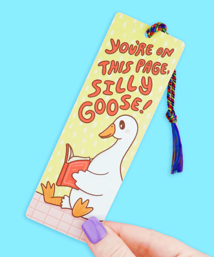 Colorful bookmark with a cartoon goose holding a book and a rainbow tassel, reading "You're on this page, silly goose