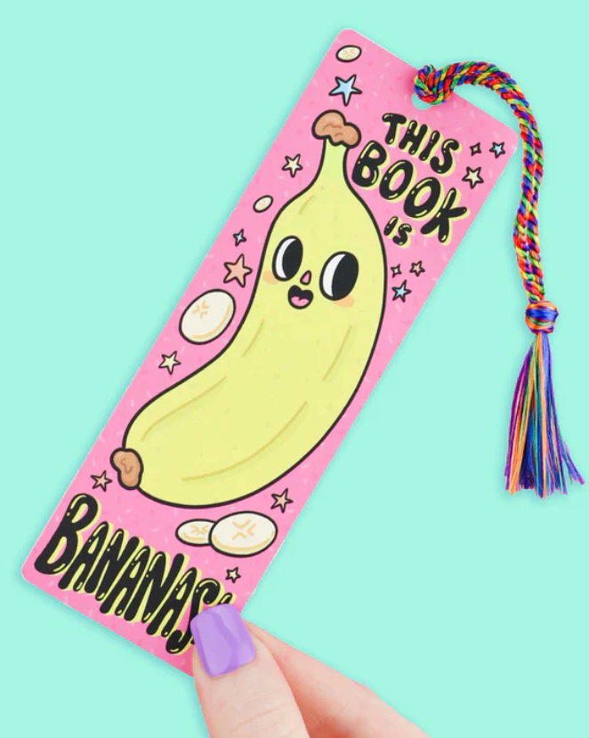 Colorful bookmark with a cute banana character and rainbow tassel, perfect for marking your spot in a novel.