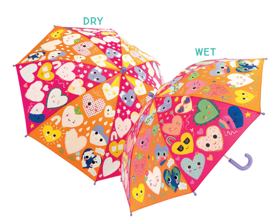 Color changing umbrella with heart and animal patterns revealing vibrant colors when wet, suitable for kids age 6 and up
