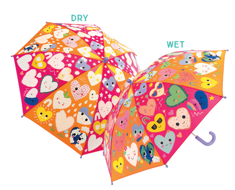 Color changing umbrella with heart and animal patterns revealing vibrant colors when wet, suitable for kids age 6 and up