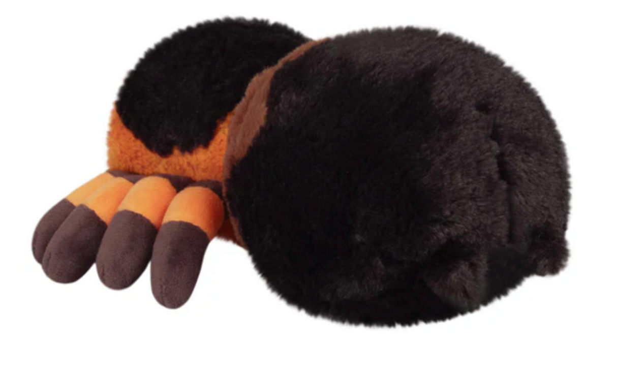 Soft plush tarantula toy with black and orange coloring, perfect for cuddling and imaginative play.